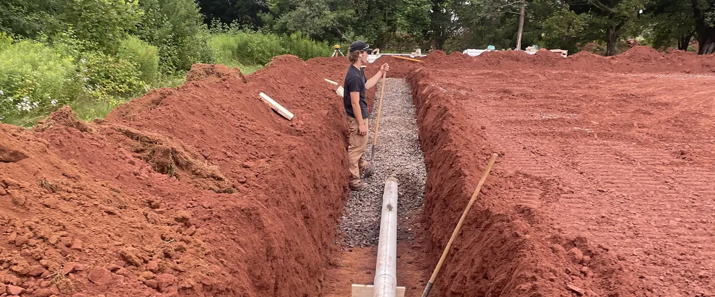 Pipe run installed in a deep red-soil trench