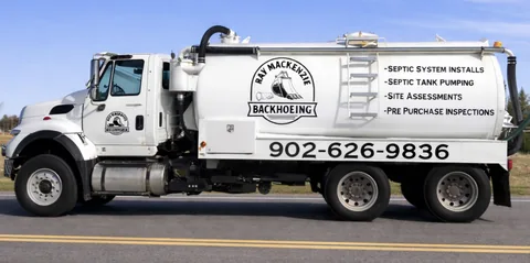 White vacuum truck with the Ray Mackenzie Backhoeing logo