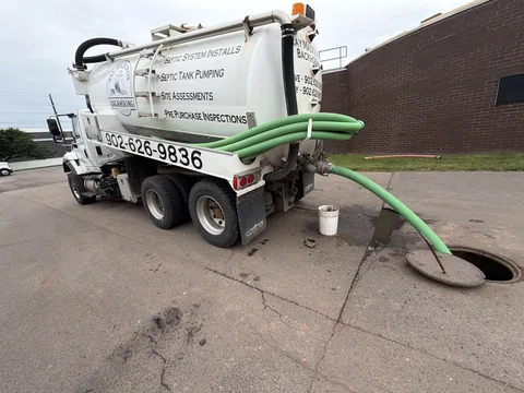 Vacuum truck pumping a septic tank